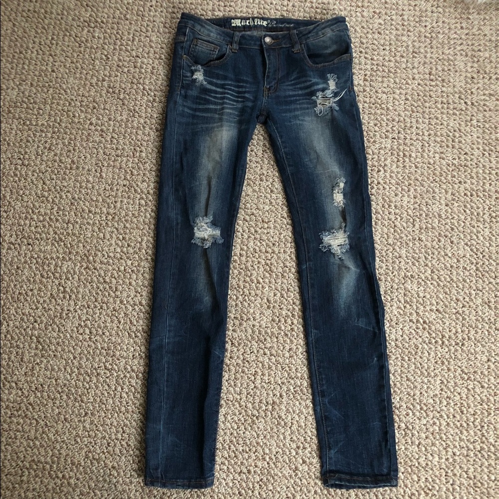 Machine distressed low rise jeans